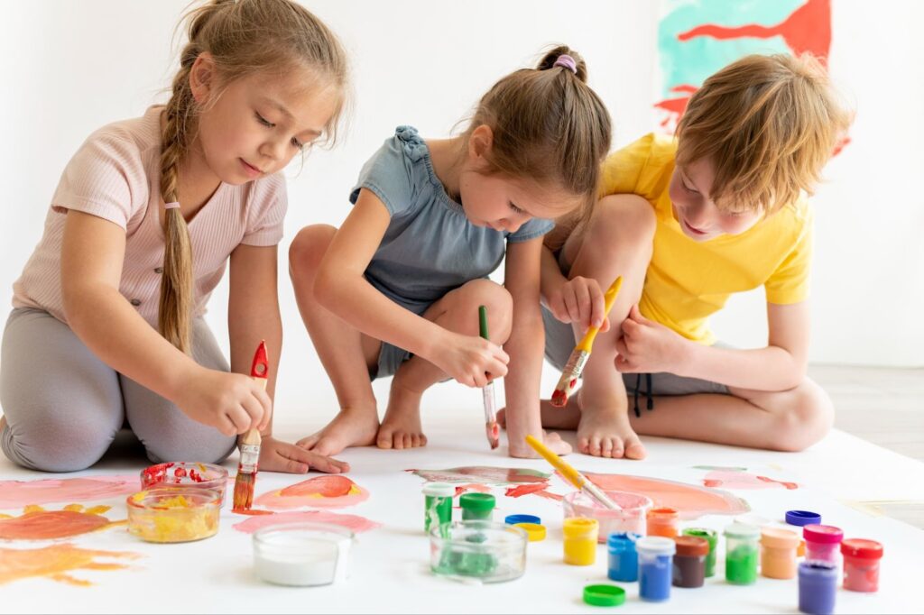 Group of children painting together